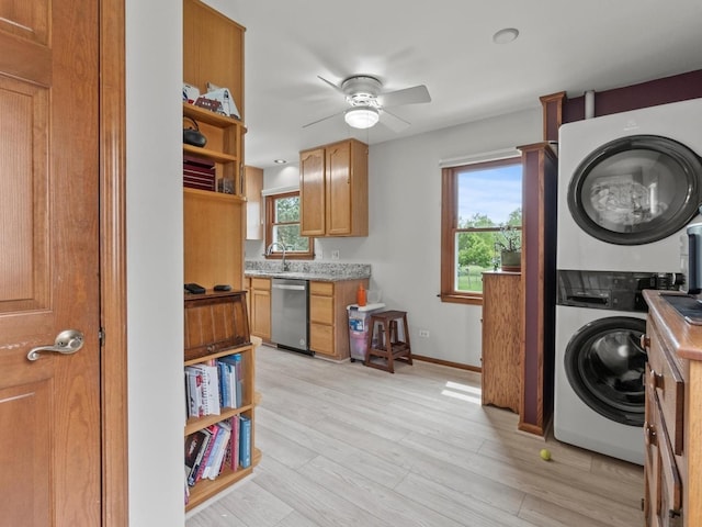 3721 Bunker Hill Dr, Algonquin, IL 60102 - laundry room with stacked washer / drying machine, plenty of natural light, a ceiling fan, and light wood-style flooring