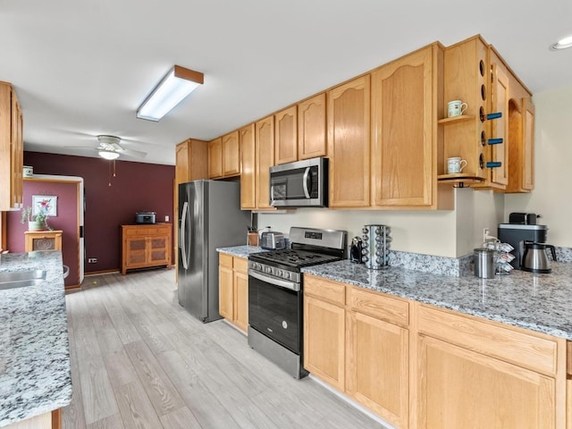 3721 Bunker Hill Dr, Algonquin, IL 60102 - kitchen featuring stainless steel appliances, light wood-style floors, ceiling fan, and light stone countertops