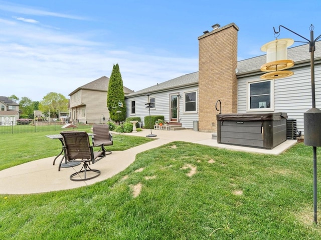 3721 Bunker Hill Dr, Algonquin, IL 60102 - back of property featuring a patio area, a hot tub, a chimney, entry steps, and central AC