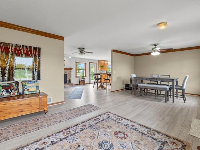 3721 Bunker Hill Dr, Algonquin, IL 60102 - living area featuring ceiling fan, ornamental molding, wood finished floors, and baseboards