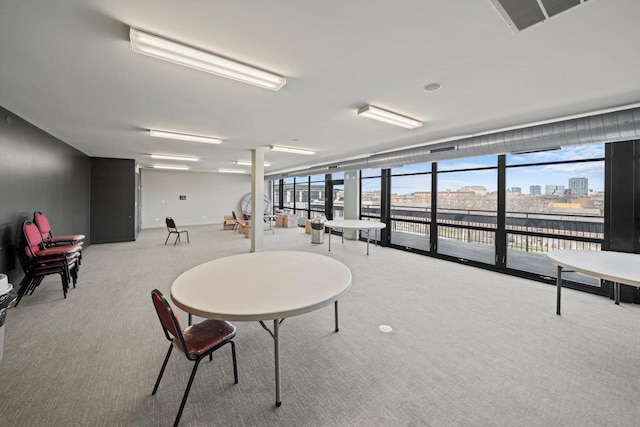 1070 W 15th St Unit 403, Chicago, IL 60608 - carpeted dining space featuring a wall of windows, plenty of natural light, and a view of city