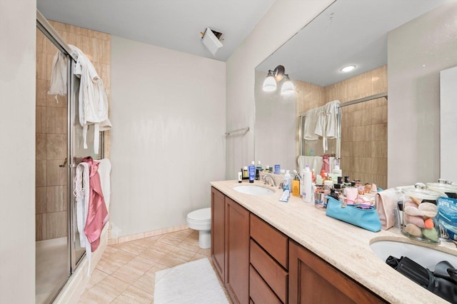 1070 W 15th St Unit 403, Chicago, IL 60608 - bathroom featuring a stall shower, double vanity, tile patterned floors, and toilet