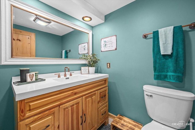 half bath with vanity and toilet