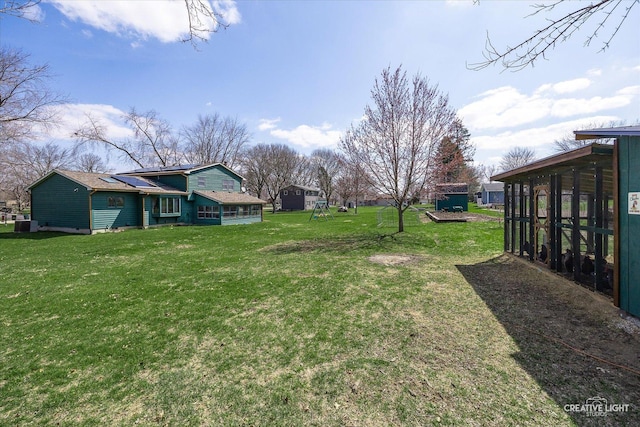 view of yard featuring a sunroom