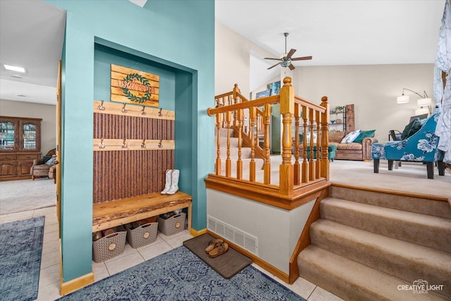 mudroom featuring tile patterned flooring, visible vents, a ceiling fan, and baseboards