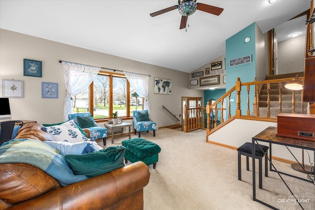 living room featuring carpet floors, a ceiling fan, stairs, and lofted ceiling