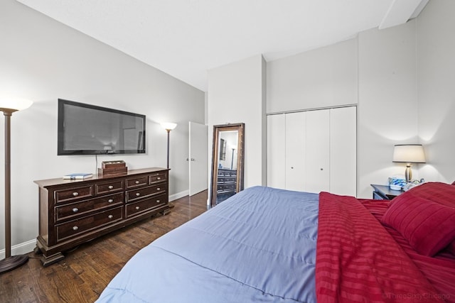 bedroom featuring baseboards, a closet, and wood finished floors