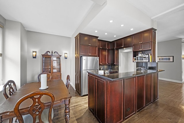 kitchen featuring recessed lighting, stainless steel appliances, baseboards, dark countertops, and dark wood-style floors