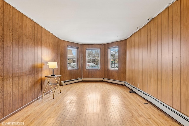 unfurnished room with wood-type flooring