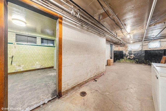 unfinished below grade area with washer / clothes dryer