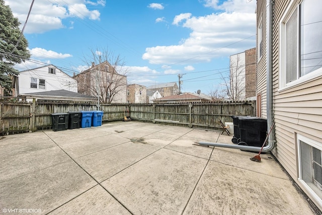 view of patio featuring central AC unit and a fenced backyard