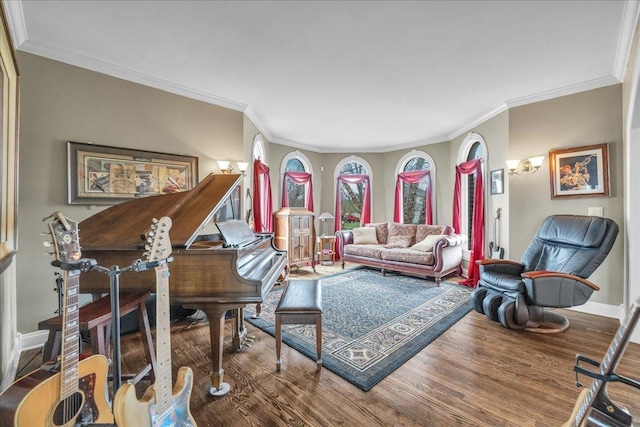 living room with baseboards, crown molding, and wood finished floors