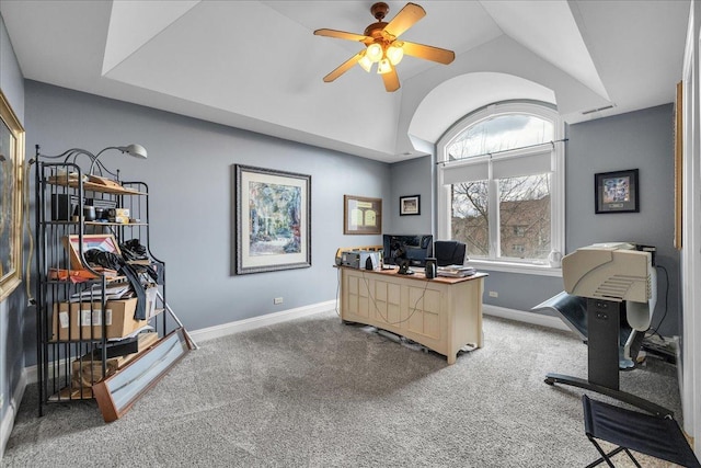 home office with baseboards, vaulted ceiling, carpet flooring, and ceiling fan