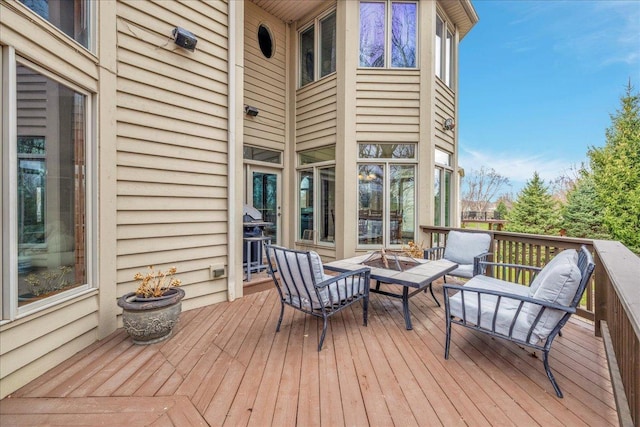 deck featuring an outdoor fire pit