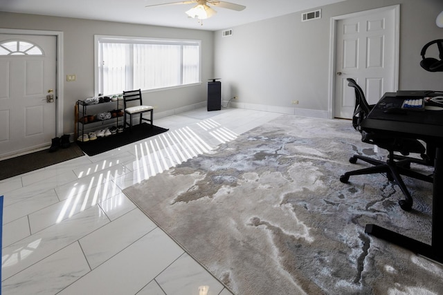 office space with a ceiling fan, marble finish floor, baseboards, and visible vents