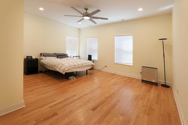 bedroom featuring visible vents, light wood finished floors, baseboards, recessed lighting, and a ceiling fan