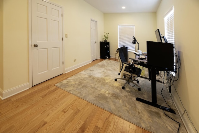 home office with light wood-style flooring, baseboards, and recessed lighting