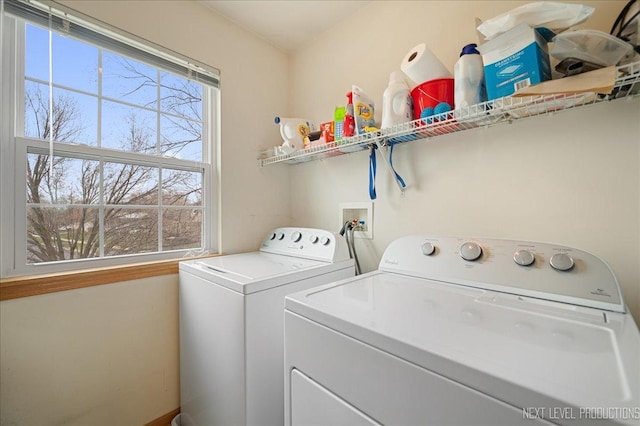 laundry room with laundry area and washing machine and clothes dryer