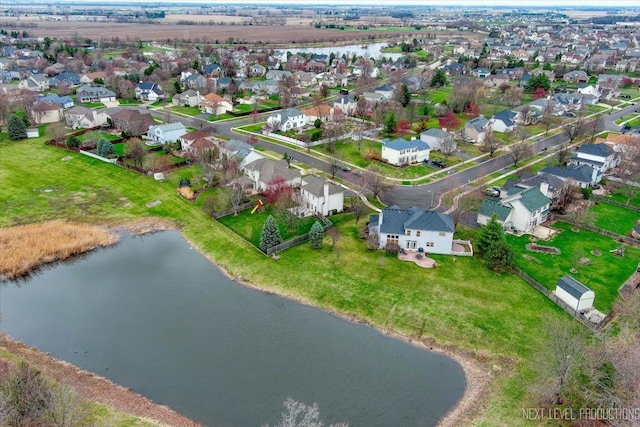 bird's eye view featuring a water view and a residential view
