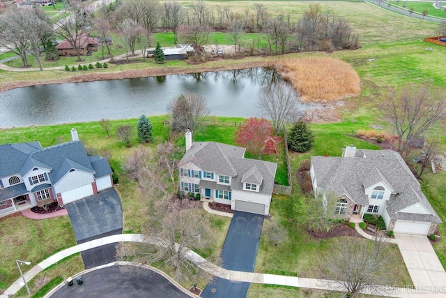 aerial view with a water view and a residential view