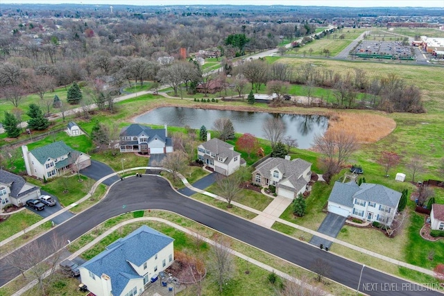 birds eye view of property featuring a water view and a residential view