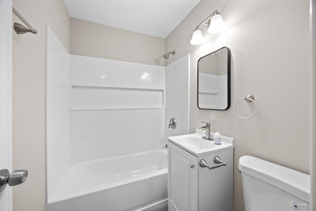 bathroom with toilet, vanity, and bathing tub / shower combination