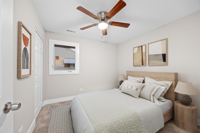 bedroom with baseboards, carpet floors, ceiling fan, and visible vents