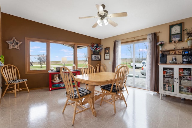 2956 Welland Rd, Earlville, IL 60518 - dining space with ceiling fan, baseboards, and lofted ceiling