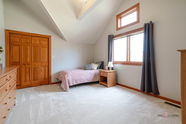bedroom featuring visible vents, baseboards, vaulted ceiling, and light carpet
