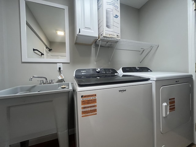 laundry area with cabinet space and washing machine and clothes dryer