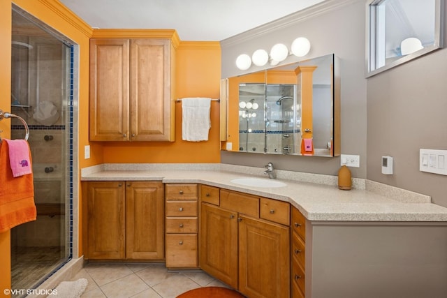 full bath with a shower stall, tile patterned floors, vanity, and crown molding