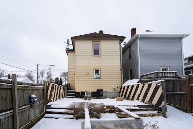 1243 S Float Ave, Freeport, IL 61032 - snow covered back of property with a fenced backyard