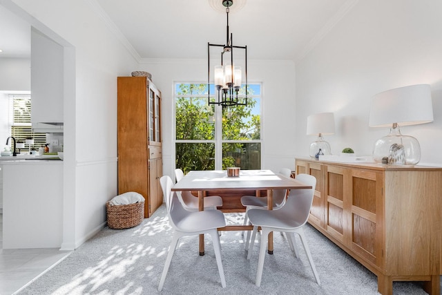 dining area with a chandelier and crown molding