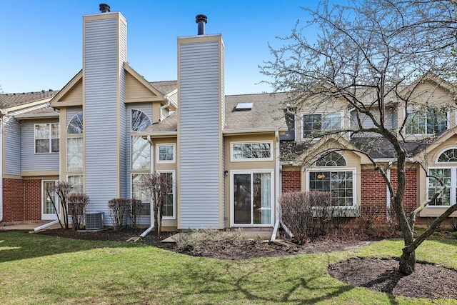 200 Glasgow Ln, Schaumburg, IL 60194 - rear view of property featuring a chimney, a yard, and a shingled roof