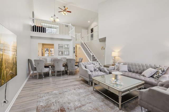 200 Glasgow Ln, Schaumburg, IL 60194 - living area with wood finished floors, a towering ceiling, stairway, and a ceiling fan
