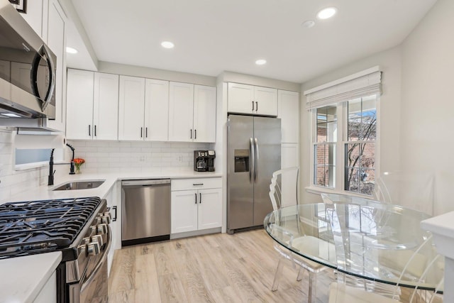 200 Glasgow Ln, Schaumburg, IL 60194 - kitchen featuring stainless steel appliances, light countertops, white cabinets, and recessed lighting