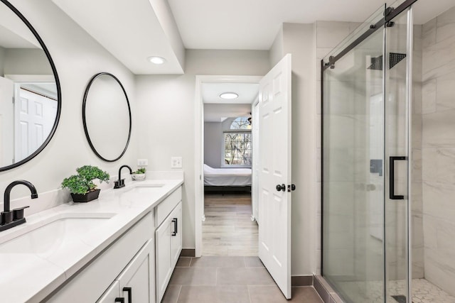 200 Glasgow Ln, Schaumburg, IL 60194 - ensuite bathroom with double vanity, a stall shower, recessed lighting, and tile patterned flooring
