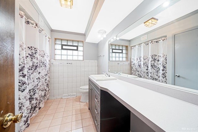 full bathroom featuring visible vents, ornamental molding, toilet, tile walls, and tile patterned flooring