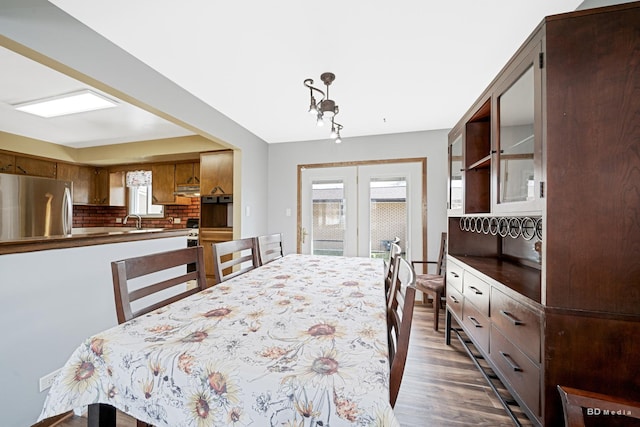 dining area featuring french doors and dark wood-style floors