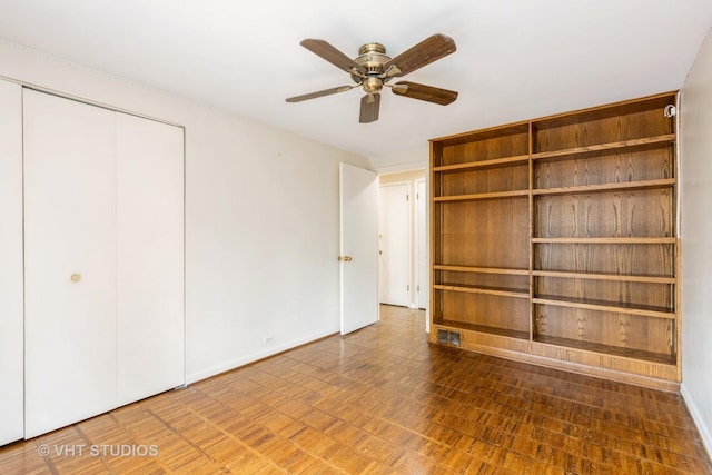 349 Ridge Rd, Kenilworth, IL 60043 - unfurnished bedroom featuring ceiling fan, a closet, and baseboards