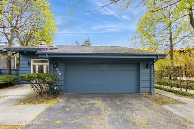 349 Ridge Rd, Kenilworth, IL 60043 - garage with driveway and fence