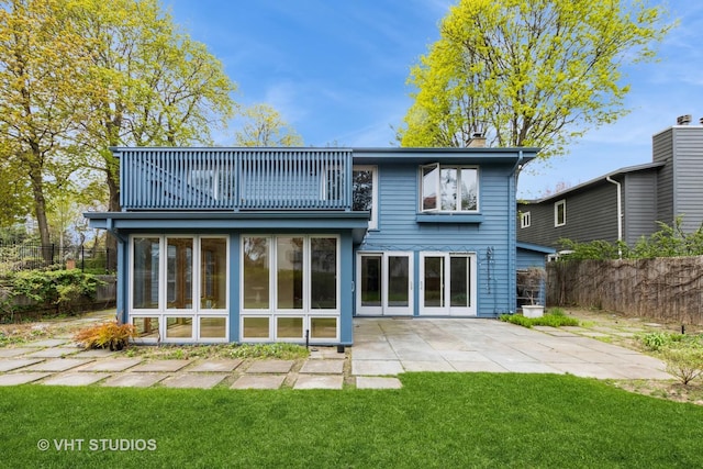 349 Ridge Rd, Kenilworth, IL 60043 - rear view of property with a patio area, fence, a balcony, a yard, and a chimney