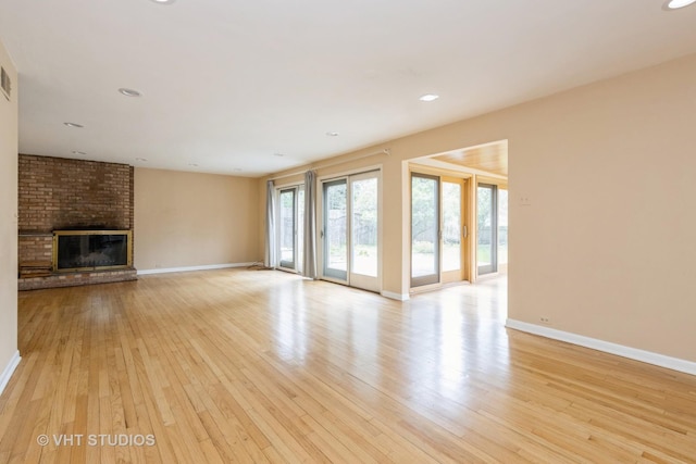 349 Ridge Rd, Kenilworth, IL 60043 - unfurnished living room with a fireplace, light wood finished floors, baseboards, and recessed lighting