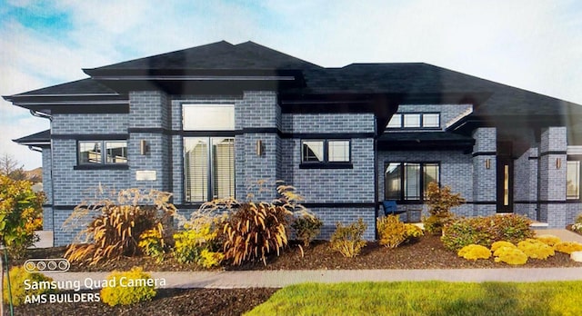 view of front facade featuring brick siding