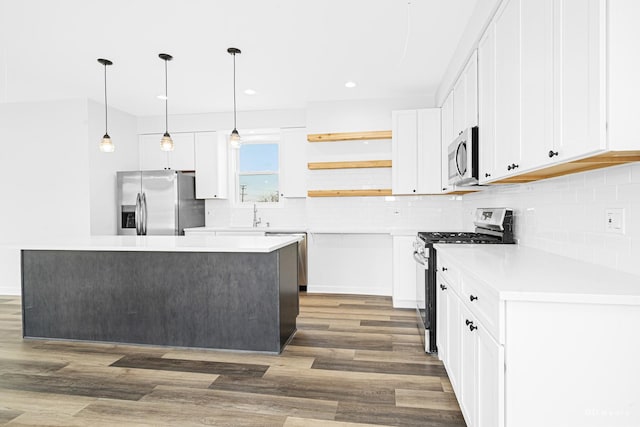18445 Kedzie Ave, Homewood, IL 60430 - kitchen with stainless steel appliances, wood finished floors, open shelves, white cabinetry, and recessed lighting
