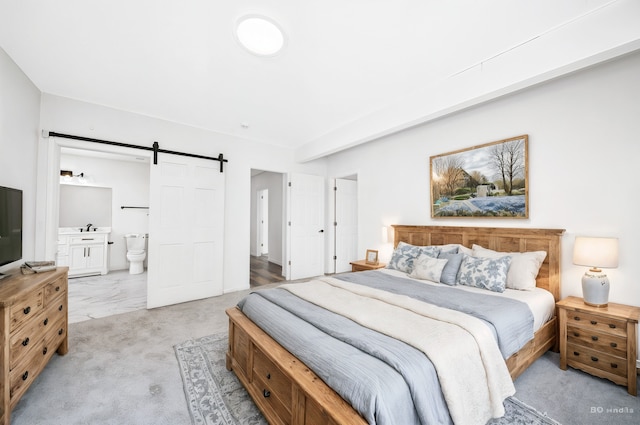 18445 Kedzie Ave, Homewood, IL 60430 - bedroom featuring a barn door, light carpet, connected bathroom, and a sink