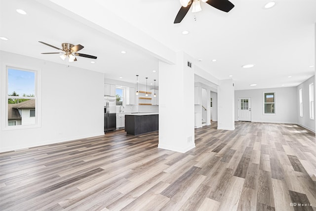 18445 Kedzie Ave, Homewood, IL 60430 - unfurnished living room with a ceiling fan, light wood-style flooring, a sink, recessed lighting, and baseboards