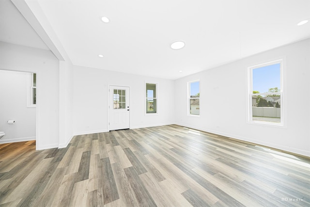 18445 Kedzie Ave, Homewood, IL 60430 - unfurnished living room with wood finished floors, baseboards, and recessed lighting
