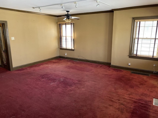 1225 E 71st Pl, Chicago, IL 60619 - carpeted spare room with ornamental molding, a ceiling fan, track lighting, and visible vents