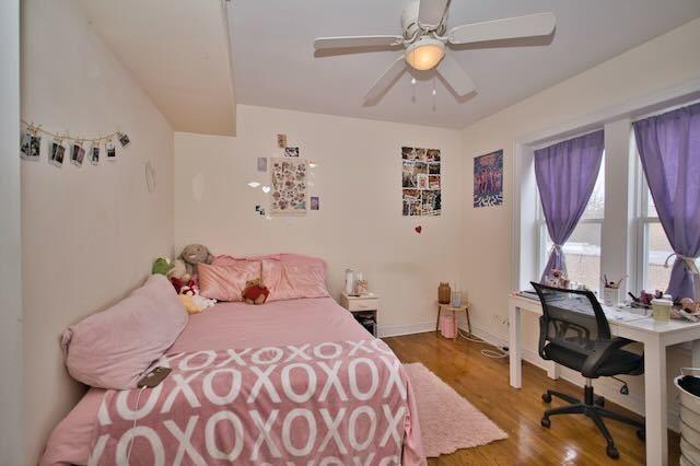 6237 N Mozart St, Chicago, IL 60659 - bedroom with baseboards and wood finished floors